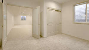 a finished basement with warm earth tones