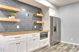 a modern basement with cabinets and shelving
