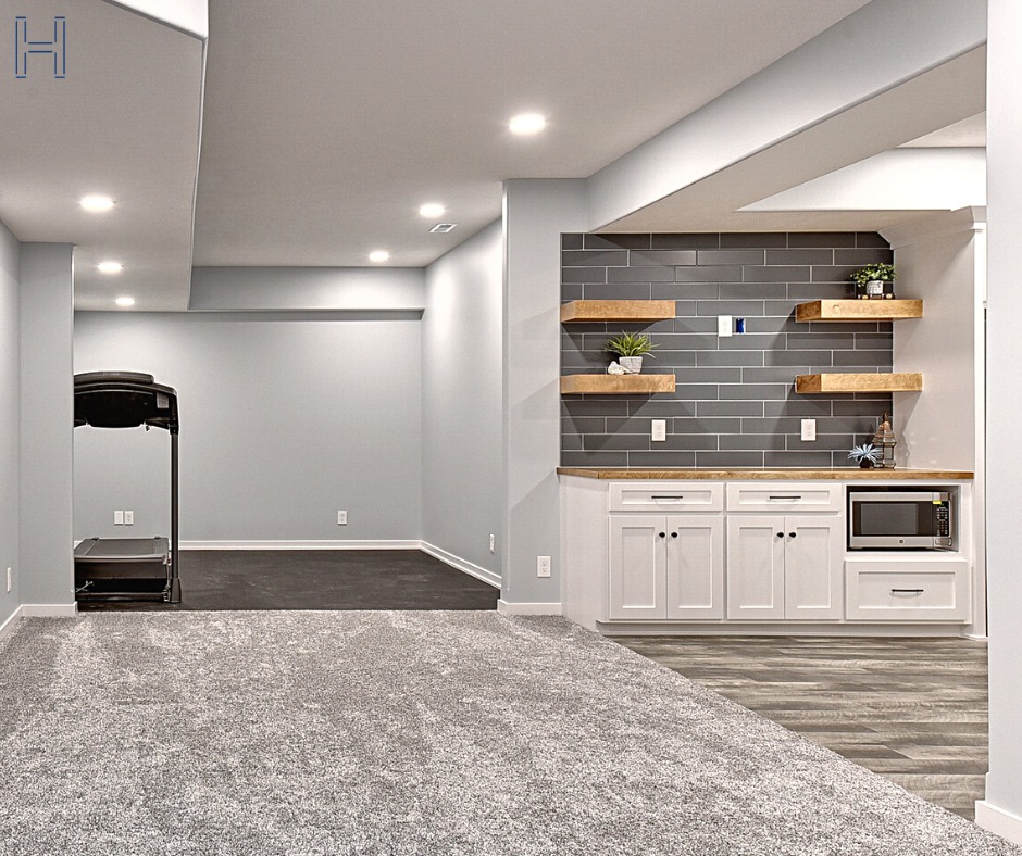 basement built-in next to a workout room in open format with a treadmill