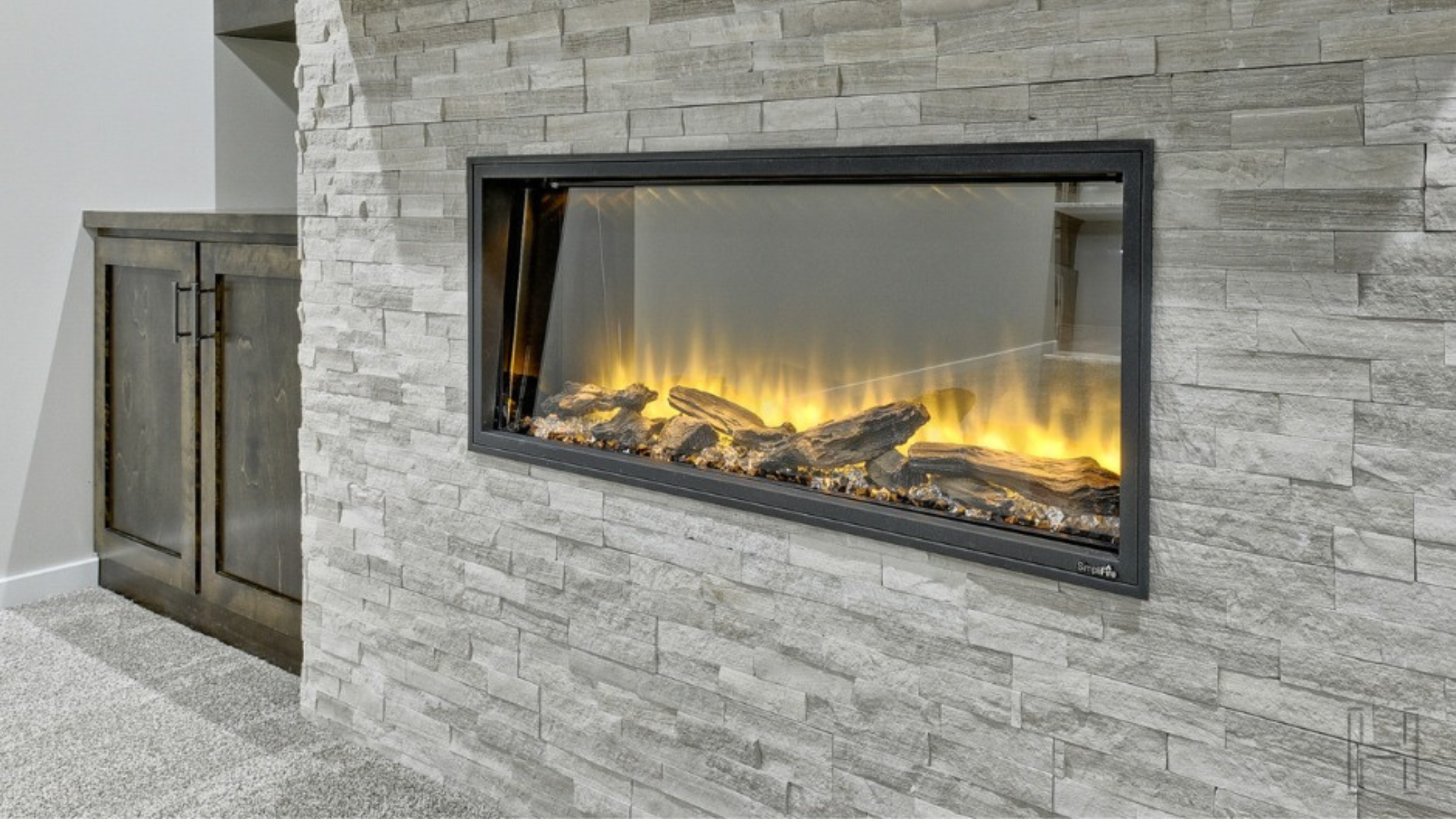 a fireplace in a newly finished basement in omaha